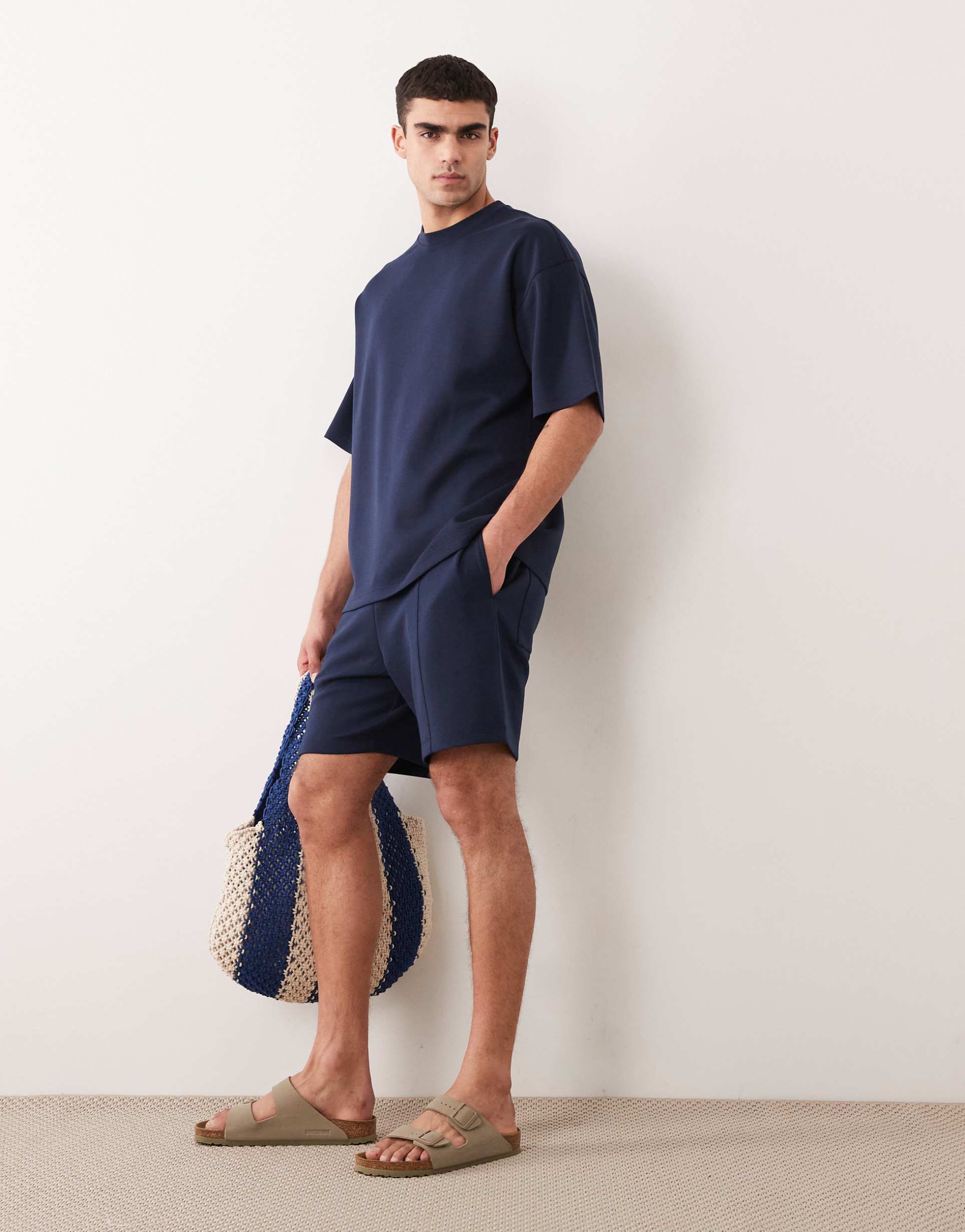ASOS DESIGN oversized jersey shorts with pintucks in navy