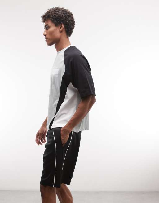 ASOS DESIGN oversized jersey shorts with piping in scuba-style fabric in black, 3 of 5
