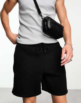 ASOS DESIGN ASOS DESIGN oversized jersey shorts with poppers in black