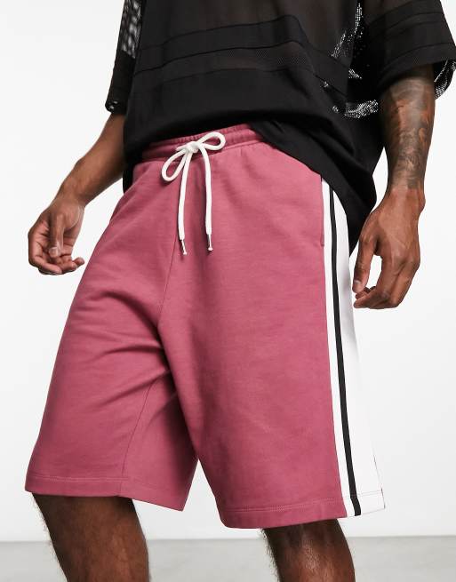 ASOS DESIGN oversized jersey shorts with side tipping in burgundy