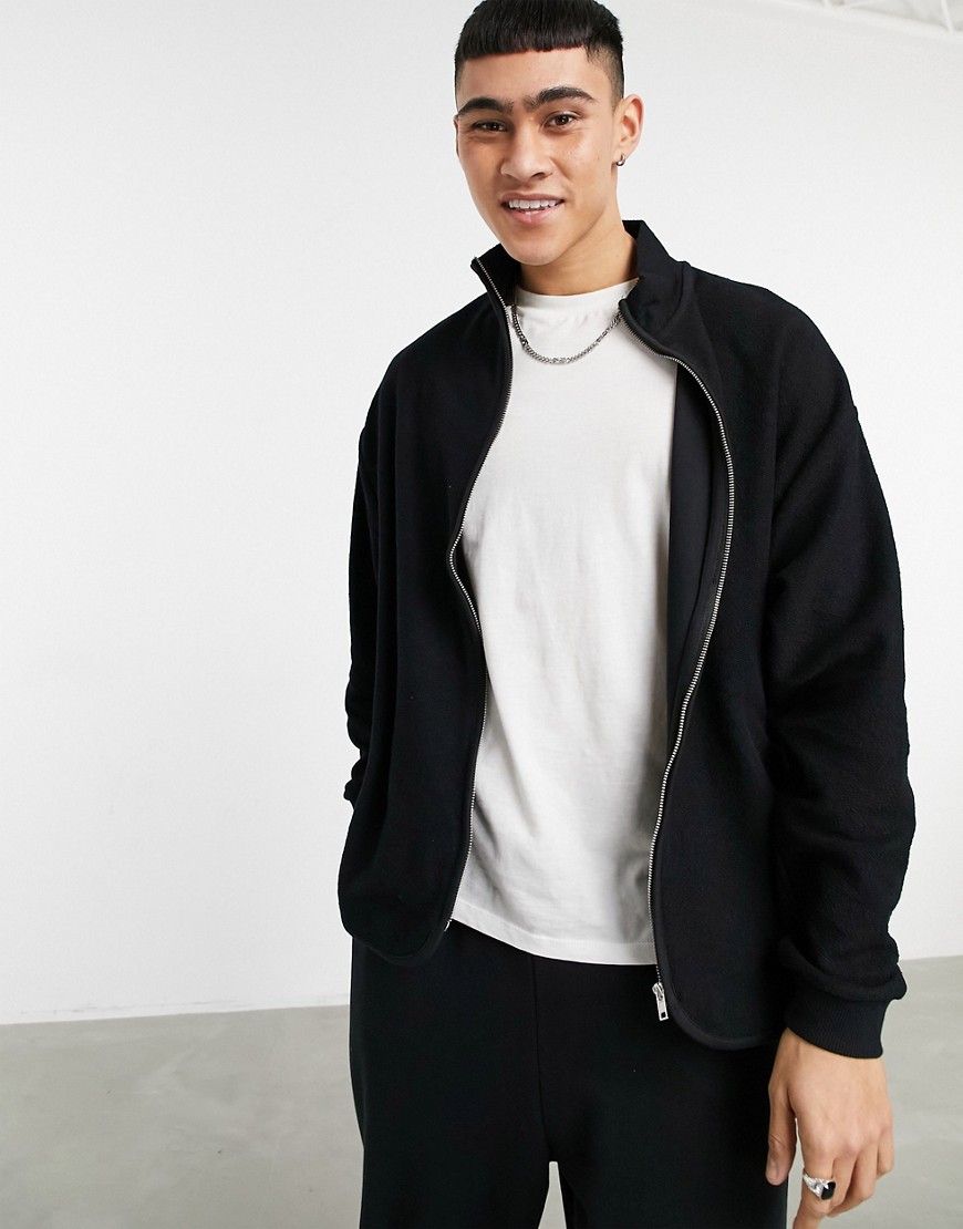 ASOS DESIGN oversized jersey track jacket in reverse loopback in black