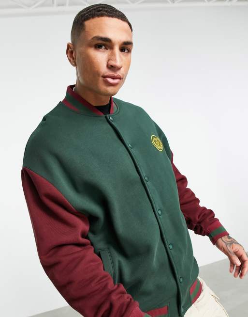 ASOS DESIGN oversized jersey varsity jacket with chest logo ASOS