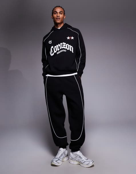 ASOS DESIGN oversized jogger and hoodie with piping detail in black - view 1