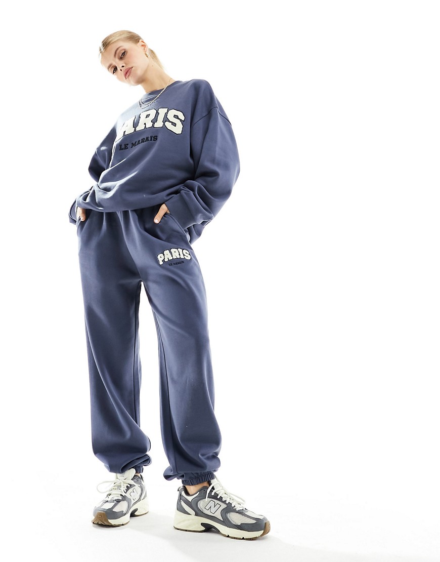 ASOS DESIGN oversized jogger co-ord with paris graphic in light navy