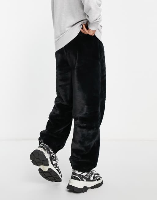 ASOS DESIGN oversized joggers in black faux fur