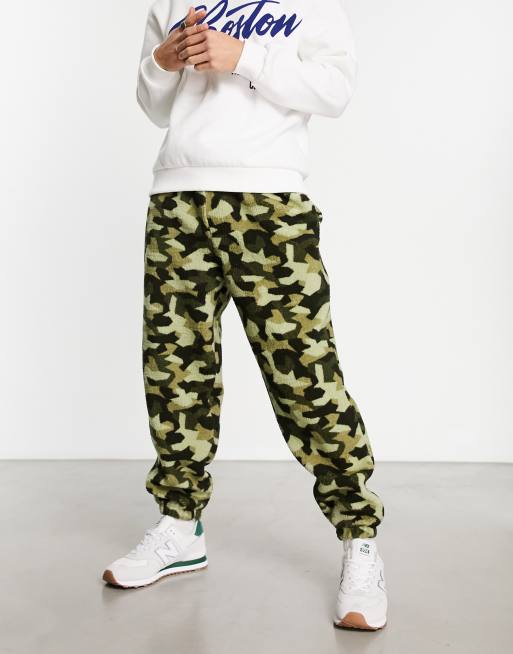 ASOS DESIGN oversized joggers in borg with camo all over print