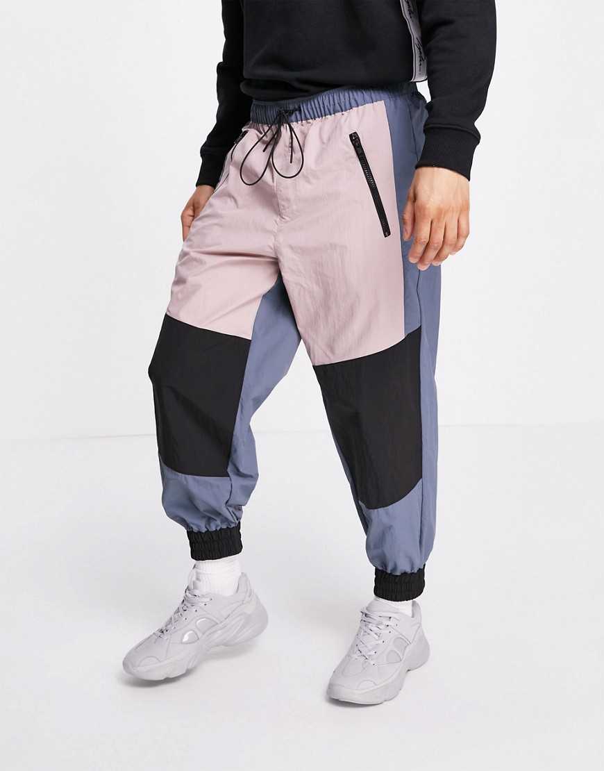 ASOS DESIGN oversized joggers in nylon with panels-Multi
