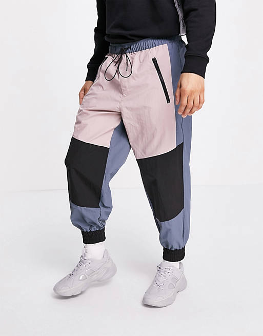 Tracksuits Joggers/oversized joggers in nylon with panels 