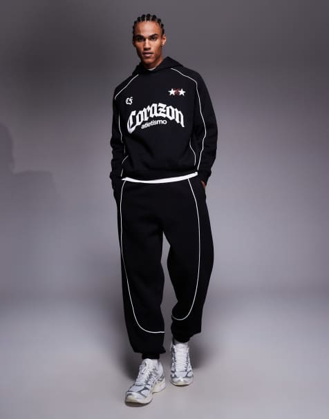 ASOS DESIGN oversized joggers with piping detail in black - view 1
