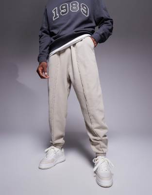 ASOS DESIGN oversized joggers with seam detail in washed beige-Neutral