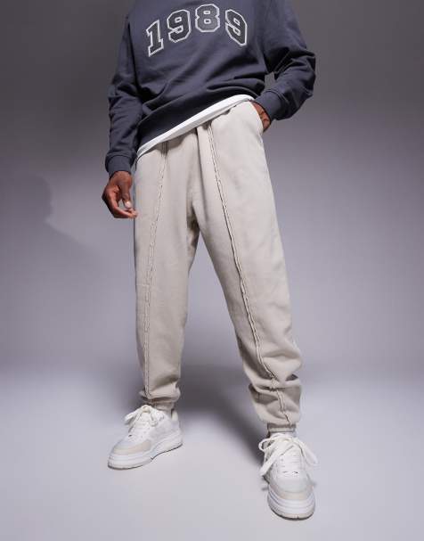 ASOS DESIGN oversized joggers with seam detail in washed beige - view 1