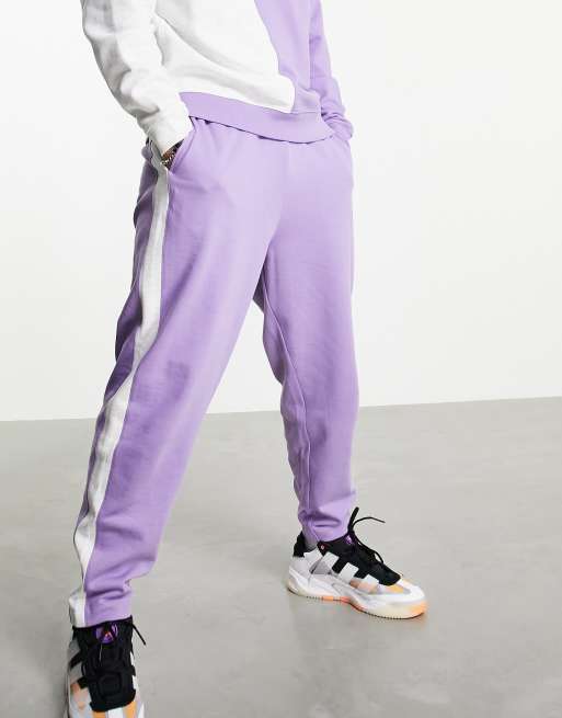 ASOS DESIGN - Oversized joggingbroek in lila met gekleurde vlakken aan zijkanten, deel van co-ord set