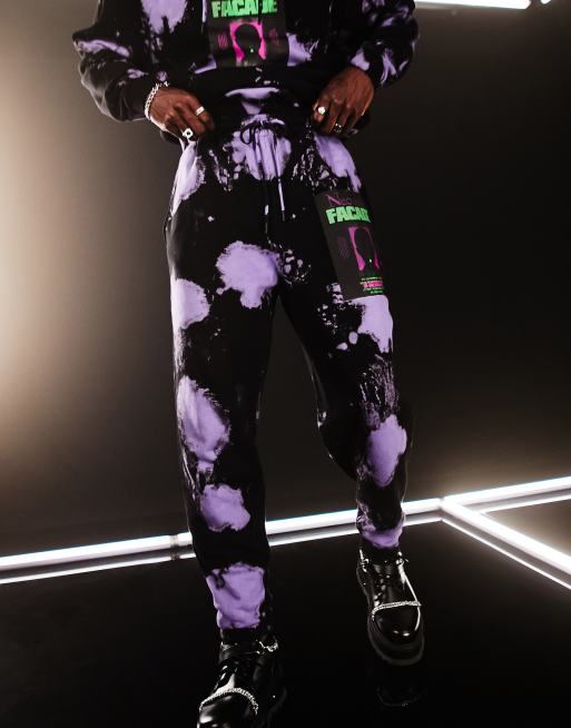 ASOS DESIGN - Oversized joggingbroek in zwarte en paarse tie-dye met tekstprint, deel van co-ord set