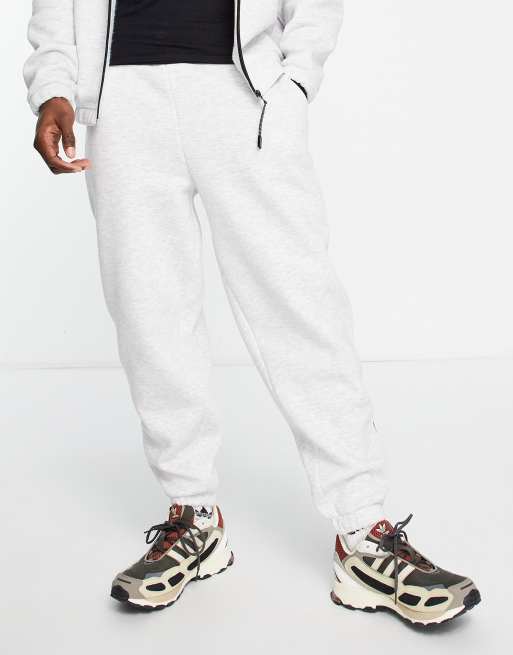ASOS DESIGN - Oversized joggingbroek met sportieve boorden met rits in gemêleerd wit, deel van combi-set, 2 van 4