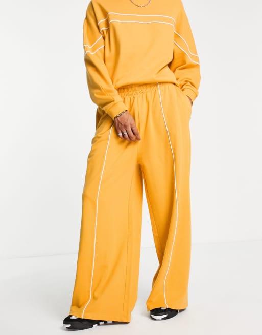 ASOS DESIGN - Oversized joggingbroek met wijde pijpen in geel, deel van co-ord set