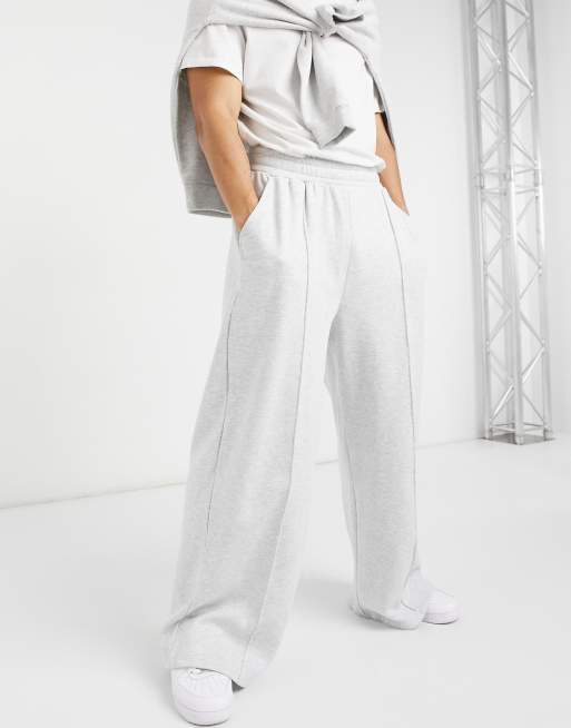 ASOS DESIGN - Oversized joggingbroek met wijde pijpen in gemêleerd wit met platgestikte plooitjes, deel van co-ord set