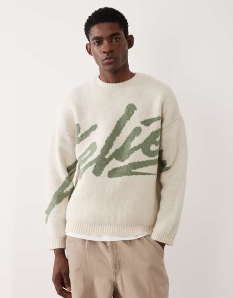 ASOS DESIGN oversized knit sweater with 'atelier' graphic in ecru and sage - view 1