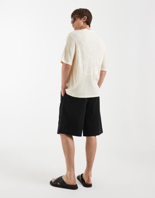 ASOS DESIGN oversized knitted short sleeve crochet notch neck polo with seoul embroidery in stone, 2 of 5