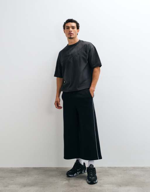 ASOS DESIGN oversized lang jort med piping i sort, 1 af 5