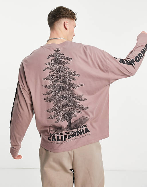  oversized long sleeve t-shirt in light pink with outdoors back and sleeve print 