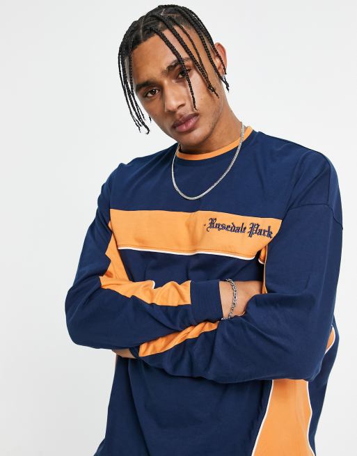 ASOS DESIGN oversized long sleeve t-shirt in navy and orange colour block with chest print
