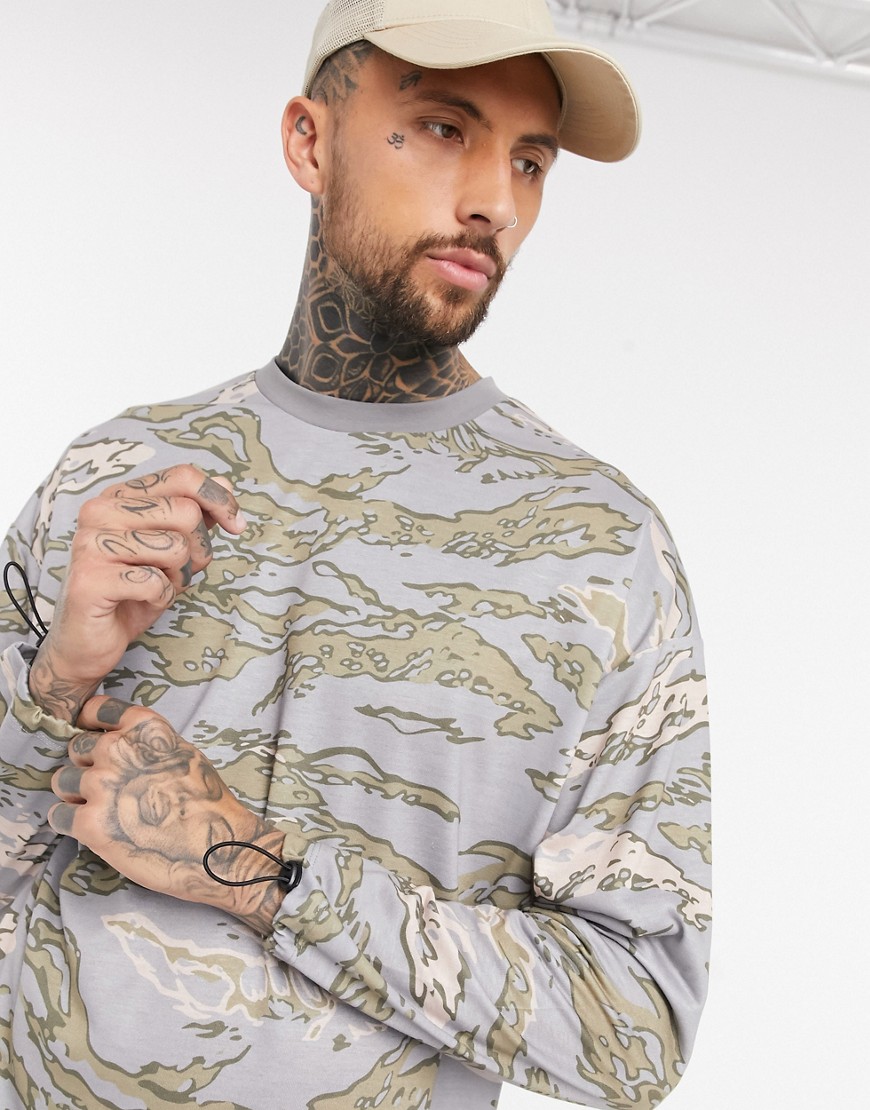 ASOS DESIGN oversized long sleeve t-shirt with all over camo marble print and cuff toggles in heavyweight jersey-Multi
