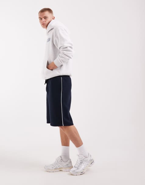 ASOS DESIGN oversized longer length jersey Bermuda shorts with piping in navy - view 1