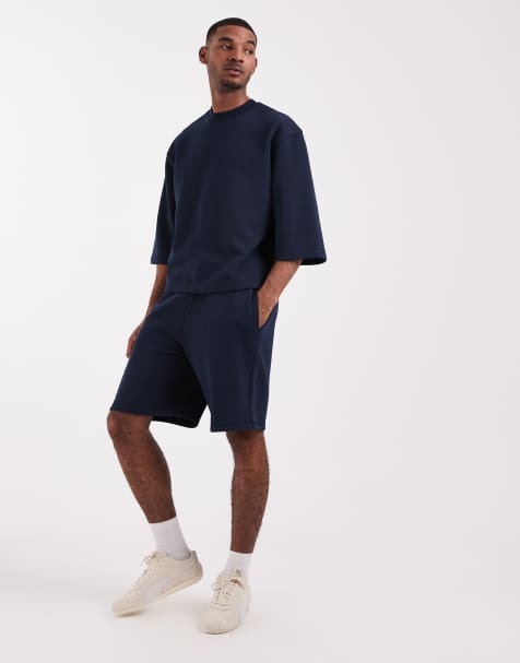 ASOS DESIGN oversized longer length jersey shorts in navy - part of a set - view 1