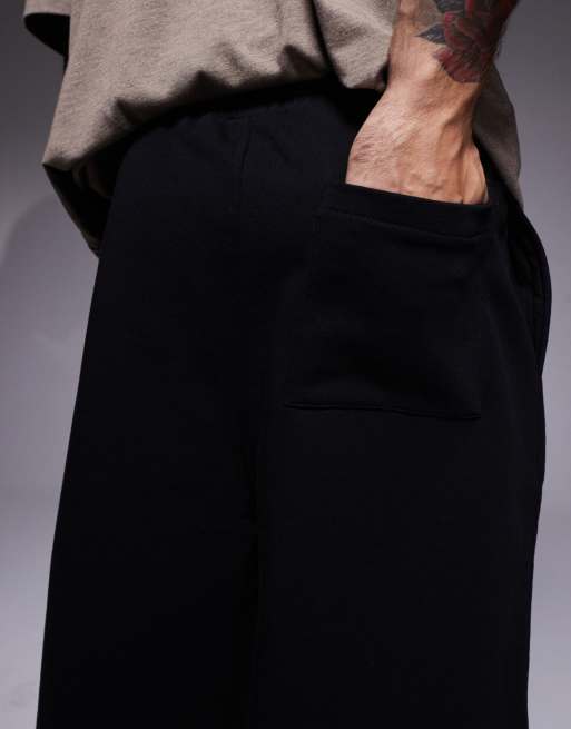 ASOS DESIGN oversized longer length shorts in black