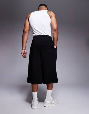 ASOS DESIGN oversized longer length shorts in black