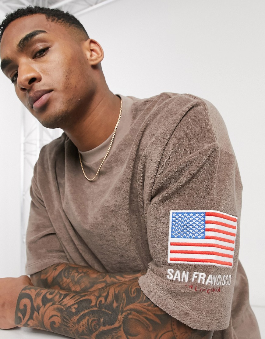 ASOS DESIGN oversized longline t-shirt with flag sleeve embroidery and city print in towelling-Brown