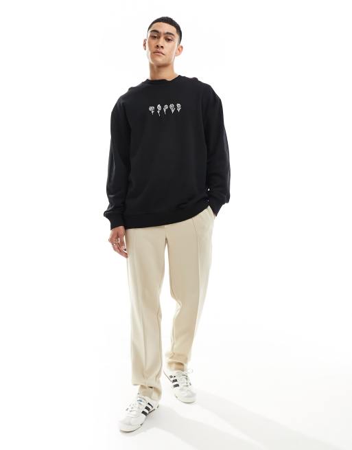 ASOS DESIGN - Oversized og sort sweatshirt med blomstret print fortil
