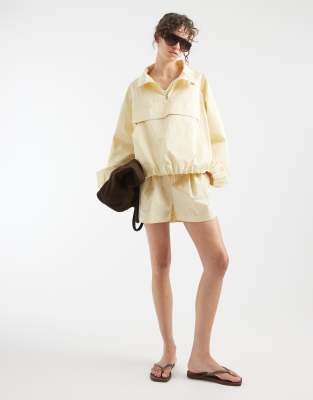 ASOS DESIGN oversized paper touch shorts in lemon yellow