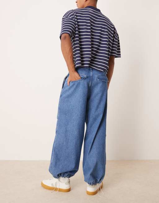 ASOS DESIGN oversized parachute jeans with drawstring and contrast stitch in mid wash blue
