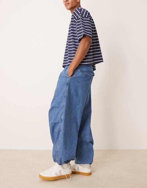 ASOS DESIGN oversized parachute jeans with drawstring and contrast stitch in mid wash blue