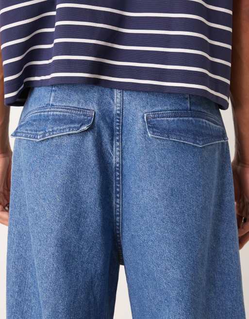 ASOS DESIGN oversized parachute jeans with drawstring and contrast stitch in mid wash blue