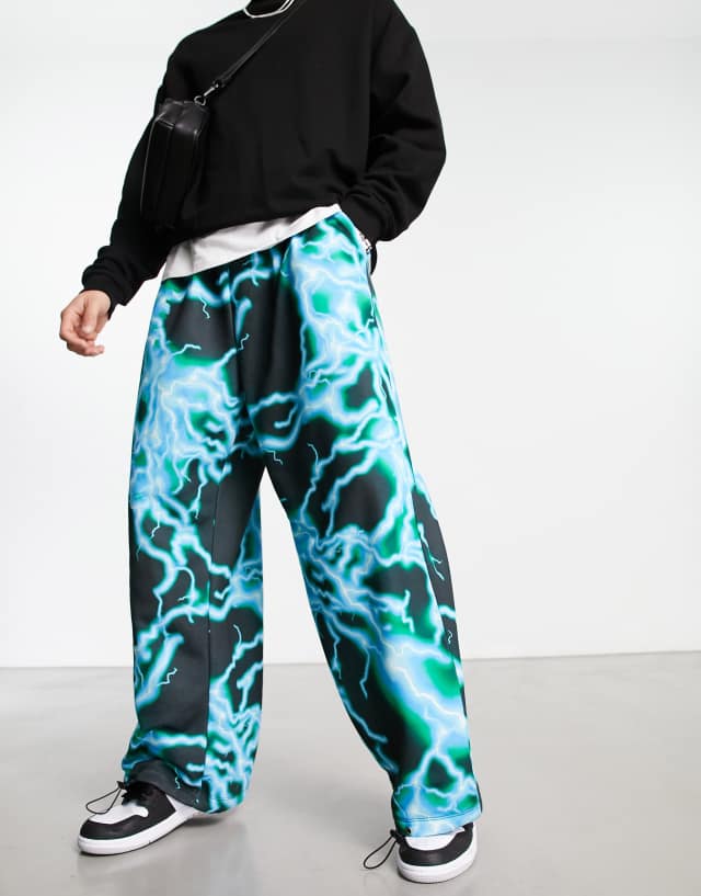 ASOS DESIGN oversized parachute sweatpants in lightning all over print