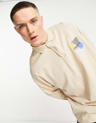ASOS DESIGN oversized polo shirt in washed beige with chest print