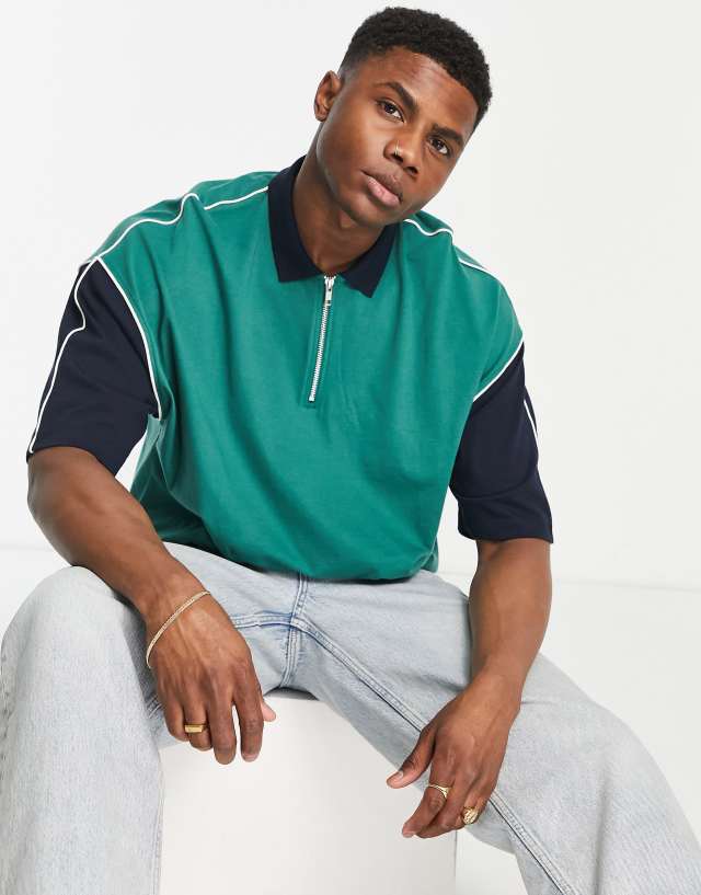 ASOS DESIGN oversized polo T-shirt in green with contrast sleeves & zip neck