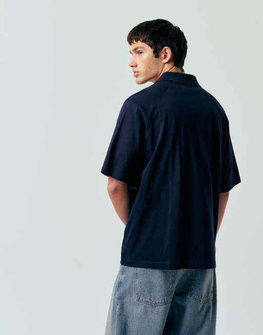 ASOS DESIGN oversized polo t-shirt with panels and paraiso graphic in navy, 3 of 5