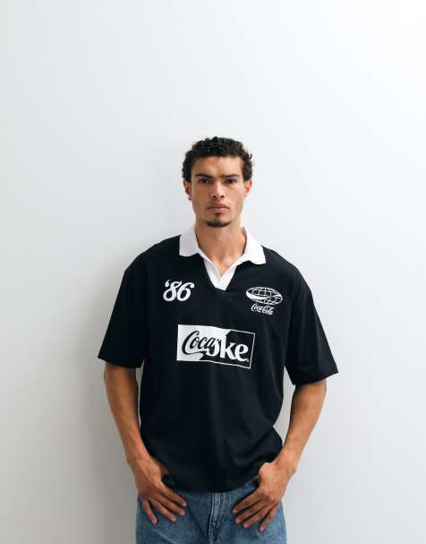 ASOS DESIGN oversized polo with Coca-Cola print in black - view 1
