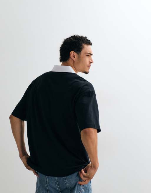 ASOS DESIGN oversized polo with Coca Cola print in Black, 2 of 5