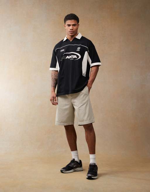 ASOS DESIGN oversized polo with cut and sew panelling and sports graphics in black, 2 of 4