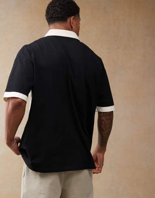 ASOS DESIGN oversized polo with cut and sew panelling and sports graphics in black, 3 of 4