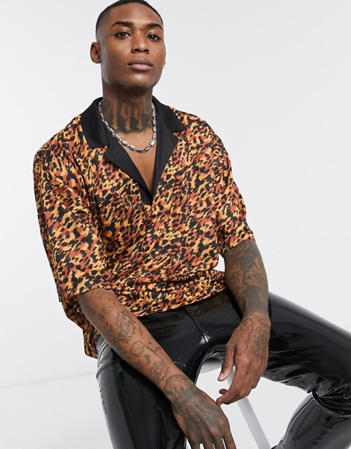 ASOS DESIGN oversized polo with deep revere collar in all over leopard print