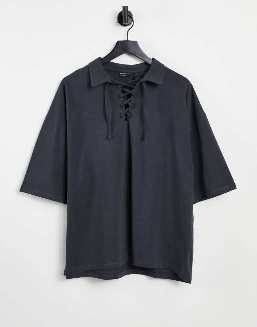 ASOS DESIGN oversized polo with half sleeve and tie neck detail in washed black