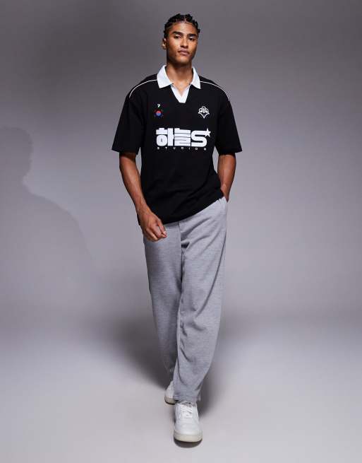 ASOS DESIGN oversized polo with piping detail and soccer graphic in black , 2 of 5