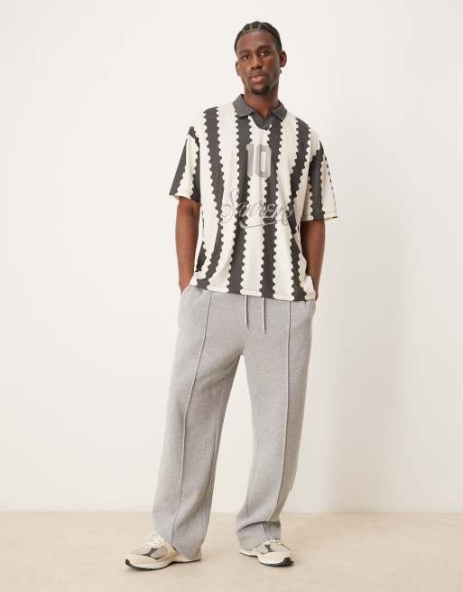 ASOS DESIGN oversized polo with sports graphic and all over print
