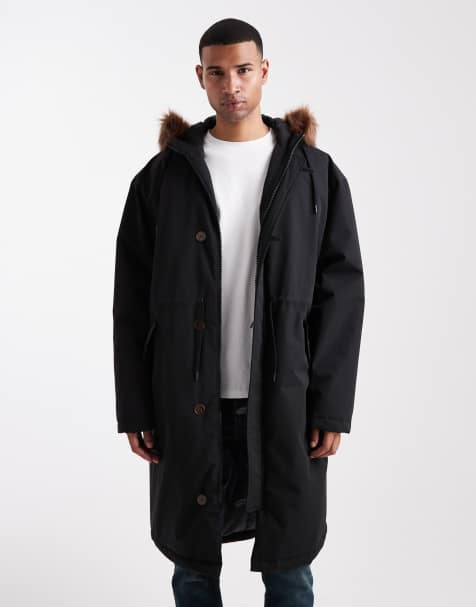 ASOS DESIGN oversized puffer jacket with faux fur hood in black - view 1
