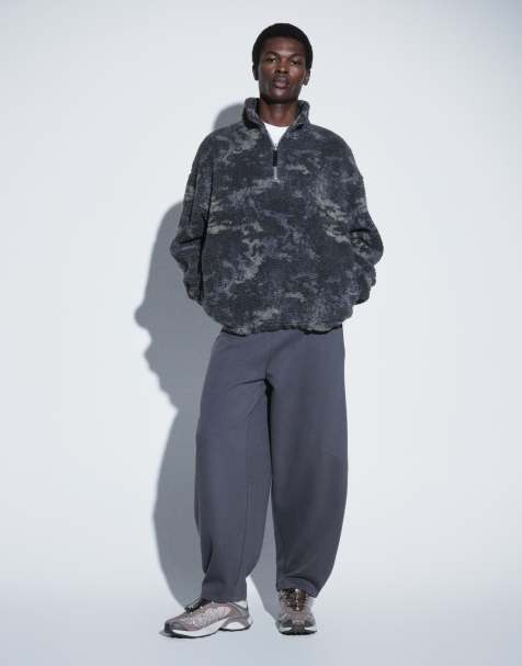 ASOS DESIGN oversized quarter zip borg sweatshirt with camo print in black - view 1